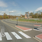 Overly large roundabout with slip lane and small median island near Food Lion