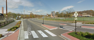 Overly large roundabout with slip lane and small median island near Food Lion